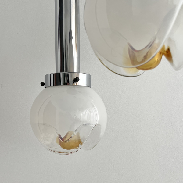 A Mezzega chandelier in a cascading trio of opaline to amber glass from the 1970s image