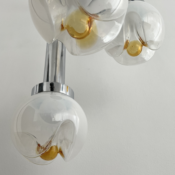 A Mezzega chandelier in a cascading trio of opaline to amber glass from the 1970s image